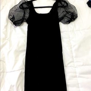 Bodycon black dress with puff sleeves